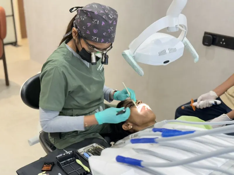 Dentist at Beyond Dental performing a painless dental treatment